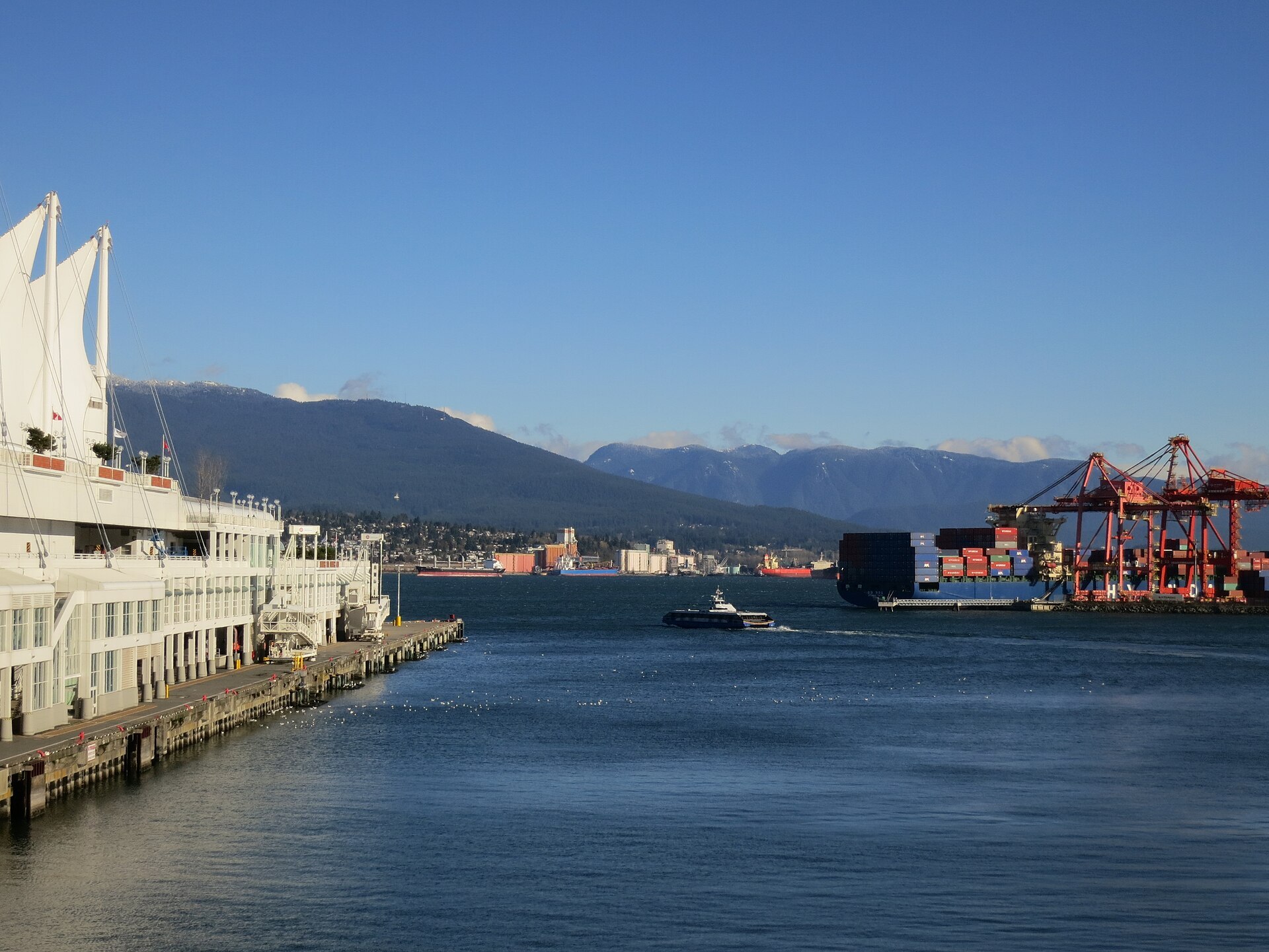 Pier, SeaBus, and port on a summer day.